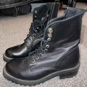 Aqua black combat boots.
